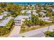 Aerial view of the home and neighborhood close to the ocean at 306 Poinsettia Rd, Anna Maria, FL 34216