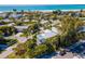 Aerial shot of the home and its surrounding neighborhood, near white sand beaches and Gulf waters at 306 Poinsettia Rd, Anna Maria, FL 34216