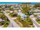 Aerial view of the property and surrounding neighborhood featuring the ocean in the distance at 306 Poinsettia Rd, Anna Maria, FL 34216