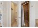 Ensuite bathroom featuring tiled shower and separate toilet room at 306 Poinsettia Rd, Anna Maria, FL 34216