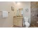 Well-maintained bathroom featuring a shower, a vanity with granite countertop, and modern fixtures at 306 Poinsettia Rd, Anna Maria, FL 34216