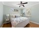 Inviting bedroom with hardwood floors and abundant natural light at 306 Poinsettia Rd, Anna Maria, FL 34216