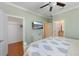 Comfortable bedroom with TV, closet, and entry to a bathroom with modern amenities and a bright interior at 306 Poinsettia Rd, Anna Maria, FL 34216