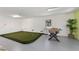 This game room includes a mini golf area, foosball table and a plant for added aesthetics at 306 Poinsettia Rd, Anna Maria, FL 34216
