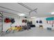 Well-organized garage space with storage racks, bicycles, and water sports equipment for active living at 306 Poinsettia Rd, Anna Maria, FL 34216