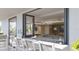 A well-appointed bar area that opens to the game room through retractable window panels at 325 Golden Gate Pt # 1004, Sarasota, FL 34236
