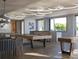 Bright game room featuring pool table, windows, modern lighting, and comfortable seating at 325 Golden Gate Pt # 1004, Sarasota, FL 34236