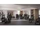 Community gym featuring exercise equipment, natural light, and storage shelves at 325 Golden Gate Pt # 1004, Sarasota, FL 34236