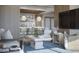Stylish and well-lit living room featuring modern furniture, a large TV, and an open kitchen at 325 Golden Gate Pt # 1004, Sarasota, FL 34236