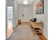 Inviting entryway with a bench, rug, and artwork creating a warm and welcoming atmosphere at 3533 Secluded Ct, Sarasota, FL 34240