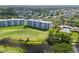 Aerial view of buildings overlooking a golf course and pool at 3790 Pinebrook Cir # 408, Bradenton, FL 34209