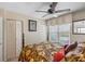 Comfortable bedroom offers ample closet space, a ceiling fan, and a bright window at 3790 Pinebrook Cir # 408, Bradenton, FL 34209