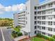Exterior of condo building with well-maintained landscaping and convenient parking at 3790 Pinebrook Cir # 408, Bradenton, FL 34209