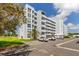 Beautiful multi-story building featuring lush landscaping and ample parking at 3790 Pinebrook Cir # 408, Bradenton, FL 34209