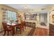 Inviting dining area featuring a wooden table set and a view into the kitchen at 3790 Pinebrook Cir # 408, Bradenton, FL 34209