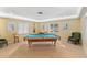 Game room with billiards table, comfortable seating, and plenty of natural light at 3790 Pinebrook Cir # 408, Bradenton, FL 34209