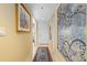 Bright hallway with decorative art leading to the front door at 3790 Pinebrook Cir # 408, Bradenton, FL 34209