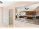 Kitchen features granite countertops, stainless steel appliances, and a convenient breakfast bar at 3790 Pinebrook Cir # 408, Bradenton, FL 34209