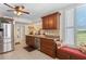Bright kitchen showcases a stainless steel fridge and a window bench seat near the sink at 3790 Pinebrook Cir # 408, Bradenton, FL 34209