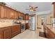 Spacious kitchen features stainless steel appliances, beautiful wood cabinetry and granite counters at 3790 Pinebrook Cir # 408, Bradenton, FL 34209