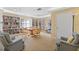 Community library with floor to ceiling bookshelves, round table with chairs, and comfortable seating at 3790 Pinebrook Cir # 408, Bradenton, FL 34209