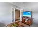 Inviting living room with French doors and entertainment center at 3790 Pinebrook Cir # 408, Bradenton, FL 34209