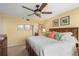 Bedroom boasts a ceiling fan, neutral colors, and ample closet space for optimal storage at 3790 Pinebrook Cir # 408, Bradenton, FL 34209