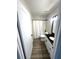 Clean bathroom with a black granite vanity, white cabinets, and shower with curtain at 4005 Crockers Lake Blvd # 11, Sarasota, FL 34238