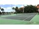 Well-maintained tennis courts surrounded by trees and fencing, offering a great recreational opportunity at 4005 Crockers Lake Blvd # 11, Sarasota, FL 34238