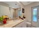 Bathroom featuring a single vanity with granite countertops, a tiled shower, and a neutral color scheme at 405 Park N Blvd, Venice, FL 34285