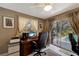 Home office with a desk, office chairs, a view of the pool, and sliding glass doors at 405 Park N Blvd, Venice, FL 34285