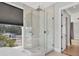 Bathroom showcasing a modern glass-enclosed shower and a window with bright natural light at 4112 Swift Rd, Sarasota, FL 34231