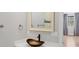 Bathroom with a unique copper sink and a modern faucet, with a mirror and view to a bedroom at 4112 Swift Rd, Sarasota, FL 34231