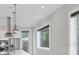 Modern kitchen featuring stainless steel appliances, pendant lighting, and bright white countertops at 4112 Swift Rd, Sarasota, FL 34231