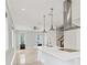 Open-concept kitchen boasting a spacious island, pendant lighting, and stainless steel appliances at 4112 Swift Rd, Sarasota, FL 34231