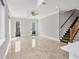 Open living room featuring modern design, tile floors, recessed lighting, staircase, and an open layout at 4112 Swift Rd, Sarasota, FL 34231