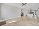 Spacious living room showing open floor plan with tile floors, modern lighting, and access to the kitchen at 4112 Swift Rd, Sarasota, FL 34231