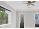 Bright living area showcasing large windows, tile flooring, modern design, and a view of outdoor greenery at 4112 Swift Rd, Sarasota, FL 34231