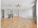 Expansive loft with light wood floors, recessed lighting, and a glass-paneled banister at 4112 Swift Rd, Sarasota, FL 34231