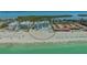 Aerial view of a beachfront property with a pool and manicured surroundings at 4651 Gulf Of Mexico Dr # 304, Longboat Key, FL 34228
