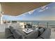 Comfortable balcony featuring plush seating and beautiful ocean views creating a perfect outdoor living space at 4651 Gulf Of Mexico Dr # 304, Longboat Key, FL 34228