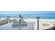 Enjoy beachfront living with this balcony view, complete with a bar, and wine, overlooking the ocean at 4651 Gulf Of Mexico Dr # 304, Longboat Key, FL 34228