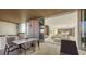 Outdoor kitchen and dining area on the balcony, creating an ideal space for entertaining with water views at 4651 Gulf Of Mexico Dr # 304, Longboat Key, FL 34228