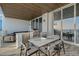Balcony features outdoor kitchen, dining area, and lounge seating with ocean views at 4651 Gulf Of Mexico Dr # 304, Longboat Key, FL 34228