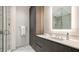 Modern bathroom featuring a glass enclosed shower, sleek vanity, and marble accents at 4651 Gulf Of Mexico Dr # 304, Longboat Key, FL 34228