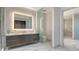 Bright bathroom features marble floors and walls, double sink vanity, glass shower, and toilet at 4651 Gulf Of Mexico Dr # 304, Longboat Key, FL 34228