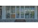 Community center entrance with glass doors featuring the Sage Longboat Key logo at 4651 Gulf Of Mexico Dr # 304, Longboat Key, FL 34228