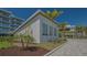 Modern building exterior with lush landscaping, showcasing contemporary design and serene surroundings at 4651 Gulf Of Mexico Dr # 304, Longboat Key, FL 34228