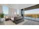 Bright main bedroom features water views and large sliding glass doors to the outdoor living area at 4651 Gulf Of Mexico Dr # 304, Longboat Key, FL 34228