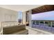 Bright main bedroom features water views and large sliding glass doors to the outdoor living area at 4651 Gulf Of Mexico Dr # 304, Longboat Key, FL 34228